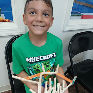 Mine Craft Camp Mine Craft Camper in a green Mine Craft Shirt